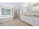 Elegant bathroom featuring dual vanities, soaking tub, and glass-enclosed shower at 4960 Haydens Walk Dr, Johns Creek, GA 30022