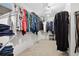 Walk-in closet with ample shelving and hanging space for organized storage at 4960 Haydens Walk Dr, Johns Creek, GA 30022