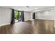 Large basement featuring sliding glass doors leading to the outside, and wood flooring at 500 Gardenia Ln, Marietta, GA 30068