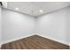 Finished basement area features neutral walls, neutral carpet and modern recessed lighting at 500 Gardenia Ln, Marietta, GA 30068