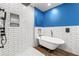 Modern bathroom with a freestanding tub, shower, and sleek fixtures at 500 Gardenia Ln, Marietta, GA 30068