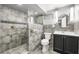 Updated bathroom with tiled shower, modern vanity, and stylish lighting fixtures at 500 Gardenia Ln, Marietta, GA 30068