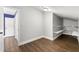 An upstairs bedroom with wood flooring, neutral walls, and a closet at 500 Gardenia Ln, Marietta, GA 30068