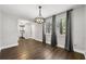Dining room with wood flooring and a modern chandelier, with natural light at 500 Gardenia Ln, Marietta, GA 30068