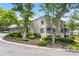 Home exterior with lush landscaping and partial driveway view at 500 Gardenia Ln, Marietta, GA 30068
