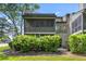 Exterior showing back of home with screened porch and well-maintained landscaping at 500 Gardenia Ln, Marietta, GA 30068