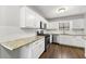 Bright kitchen with stainless appliances, granite counters, and white cabinets at 500 Gardenia Ln, Marietta, GA 30068