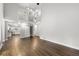Open-concept living room with hardwood floors and a view of the kitchen area at 500 Gardenia Ln, Marietta, GA 30068