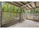 Cozy covered patio with lattice walls overlooking lush greenery at 500 Gardenia Ln, Marietta, GA 30068