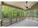 Relaxing screened porch with fan offering views of the lush backyard at 500 Gardenia Ln, Marietta, GA 30068