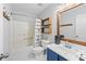 Bathroom with tub, shower, and decorative shelving at 850 Long Branch Cir, Sugar Hill, GA 30518