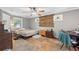 Bedroom featuring decorative wall art, ceiling fan, unique floor and natural light at 850 Long Branch Cir, Sugar Hill, GA 30518