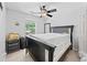 Bedroom with a dark wood bed frame and a window view at 850 Long Branch Cir, Sugar Hill, GA 30518