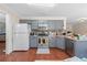 Functional kitchen featuring grey cabinets, stainless steel appliances, and an island counter at 850 Long Branch Cir, Sugar Hill, GA 30518