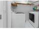Laundry room with white washer and dryer at 850 Long Branch Cir, Sugar Hill, GA 30518