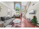 Inviting living room showcases high ceilings, hardwood floors, and abundant natural light at 850 Long Branch Cir, Sugar Hill, GA 30518