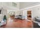 Spacious living room with hardwood floors and open layout offers versatile living and entertaining options at 850 Long Branch Cir, Sugar Hill, GA 30518