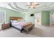 Spacious main bedroom with tray ceilings, carpet, and plenty of natural light at 850 Long Branch Cir, Sugar Hill, GA 30518