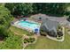 A refreshing community pool with ample seating, promising relaxation and fun in a beautifully landscaped setting at 850 Long Branch Cir, Sugar Hill, GA 30518