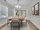 Elegant dining room with modern chandelier, stylish wood table, and neutral decor for Gathering gatherings at 955 Mill Creek Ave, Canton, GA 30115