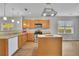 Bright kitchen features wood cabinetry, stainless steel appliances, and a functional island for meal prep at 955 Mill Creek Ave, Canton, GA 30115