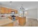 Bright kitchen features wood cabinetry, stainless steel appliances, and a practical center island at 955 Mill Creek Ave, Canton, GA 30115