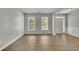 Bright living room with wood floors, neutral walls, and natural light from large windows at 955 Mill Creek Ave, Canton, GA 30115