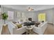 Bright living room features neutral decor, a cozy fireplace, and abundant natural light from large windows at 955 Mill Creek Ave, Canton, GA 30115