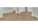 Open-concept living space boasting beautiful wood floors, neutral walls, and modern trim at 955 Mill Creek Ave, Canton, GA 30115