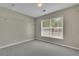 Spacious walk-in closet with carpet, wire shelving, and a window for natural light at 955 Mill Creek Ave, Canton, GA 30115