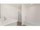 Bathroom featuring dual sinks, soaking tub and shower at 613 Lobelia Way, Locust Grove, GA 30248
