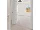 A bright bedroom has a closet and a view of the exterior at 613 Lobelia Way, Locust Grove, GA 30248