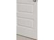 A white interior door with three panels at 613 Lobelia Way, Locust Grove, GA 30248