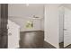 Open entryway with hardwood floors, a ceiling fan, and a view into the living room at 613 Lobelia Way, Locust Grove, GA 30248