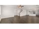 Hardwood floor expanse, adjoining kitchen, leading from entry, and up stairs to the bedrooms at 613 Lobelia Way, Locust Grove, GA 30248