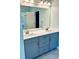 Stylish bathroom features a double sink vanity with gray cabinets and modern fixtures at 6605 New Ridge Court Ct, Cumming, GA 30041