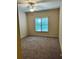 Cozy bedroom featuring plush carpeting and a ceiling fan for added comfort at 6605 New Ridge Court Ct, Cumming, GA 30041