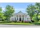 Community clubhouse exterior showcasing large columns and beautiful landscaping at 6605 New Ridge Court Ct, Cumming, GA 30041