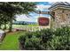 Community entrance sign near a golf course and mountains in the distance at 6605 New Ridge Court Ct, Cumming, GA 30041