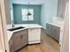Bright kitchen features gray cabinets, quartz countertops, and stainless steel appliances at 6605 New Ridge Court Ct, Cumming, GA 30041