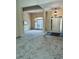 Open living room with large windows, neutral carpet, and modern chandelier at 6605 New Ridge Court Ct, Cumming, GA 30041