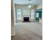 Spacious living room with a fireplace and large windows for natural light at 6605 New Ridge Court Ct, Cumming, GA 30041
