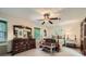 Inviting bedroom with a decorative bench, dresser, and abundant natural light, creating a relaxing atmosphere at 1580 Smyrna Sw Rd, Conyers, GA 30094