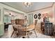 Dining room with wood table, stylish decor, and an open layout to the living room at 1580 Smyrna Sw Rd, Conyers, GA 30094