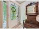 Inviting entryway with a decorative mirror and a front door with sidelight at 1580 Smyrna Sw Rd, Conyers, GA 30094