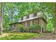 Charming brick home with manicured landscaping, mature trees and a welcoming entrance at 1580 Smyrna Sw Rd, Conyers, GA 30094