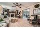 Bright living room with a fireplace, built-in shelving, and access to the sunroom, perfect for relaxation and entertainment at 1580 Smyrna Sw Rd, Conyers, GA 30094