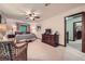 Bright main bedroom with a cozy seating area, elegant furniture, and convenient access to the hallway at 1580 Smyrna Sw Rd, Conyers, GA 30094