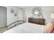 Bright bedroom showcases a decorative mirror, adding a stylish touch at 174 Aster Avenue, Locust Grove, GA 30248