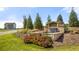 Cedar Ridge entrance featuring natural stone and floral arrangements creating a scenic entrance and neighborhood welcome at 174 Aster Avenue, Locust Grove, GA 30248